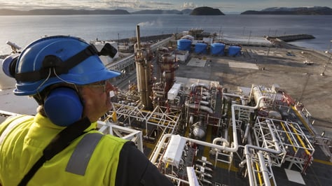 oil-worker-looking-over-gas-plant